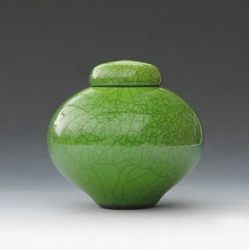 Imperial green raku lidded jar, side left