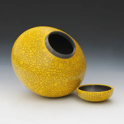 Imperial yellow raku lidded jar, cap open