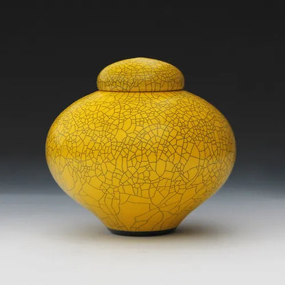 Imperial yellow raku lidded jar, side