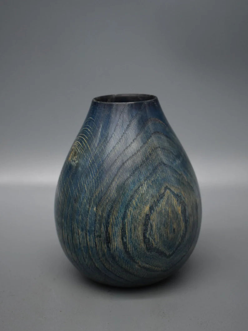 Blue vase in oak wood