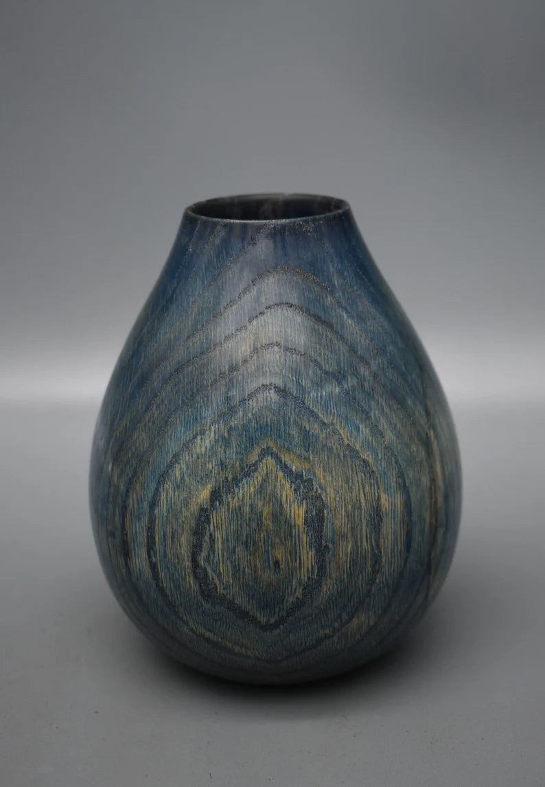 Blue vase in oak wood