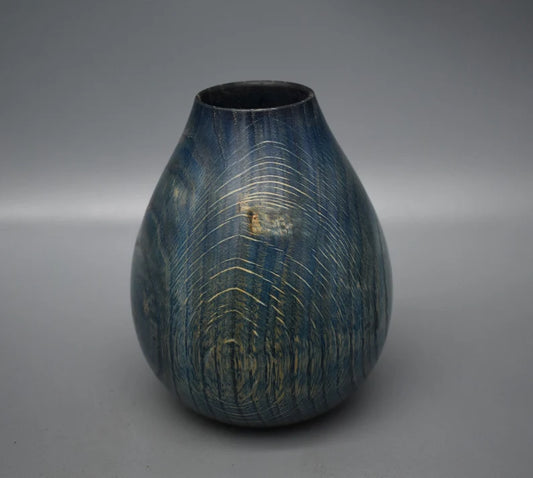 Blue vase in oak wood