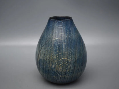 Blue vase in oak wood