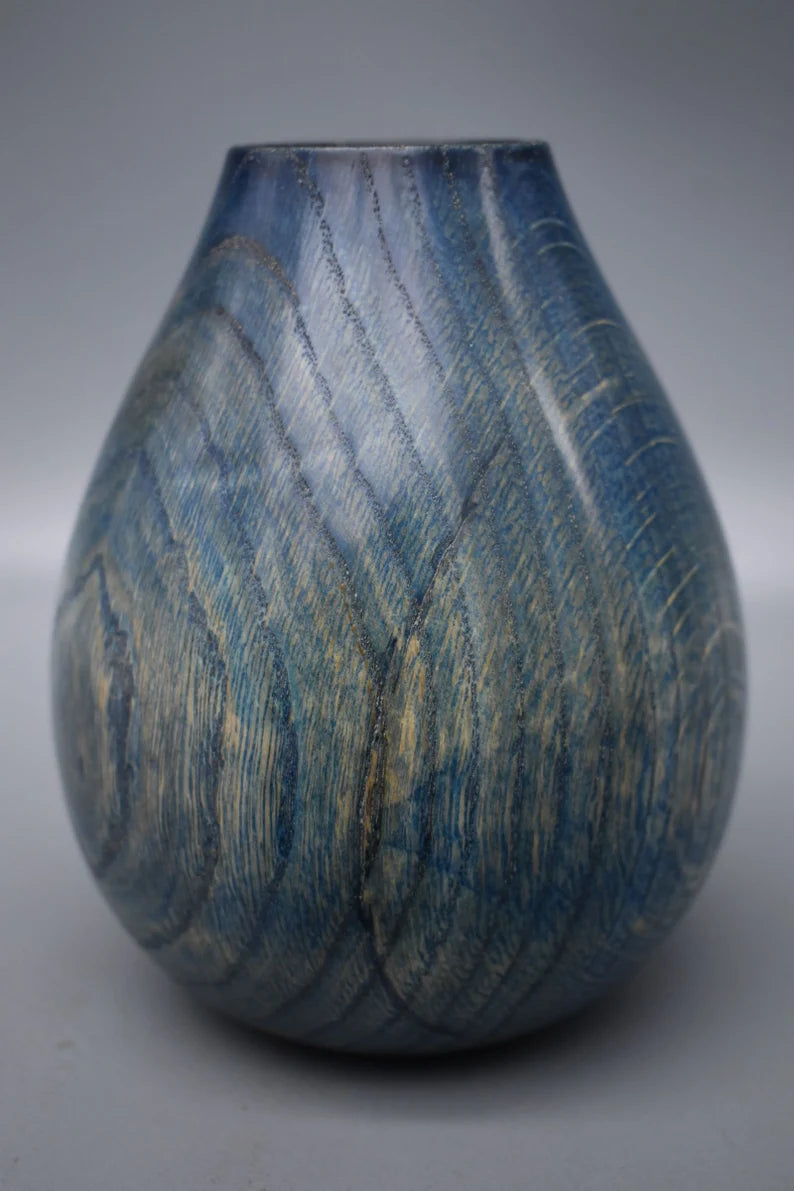 Blue vase in oak wood