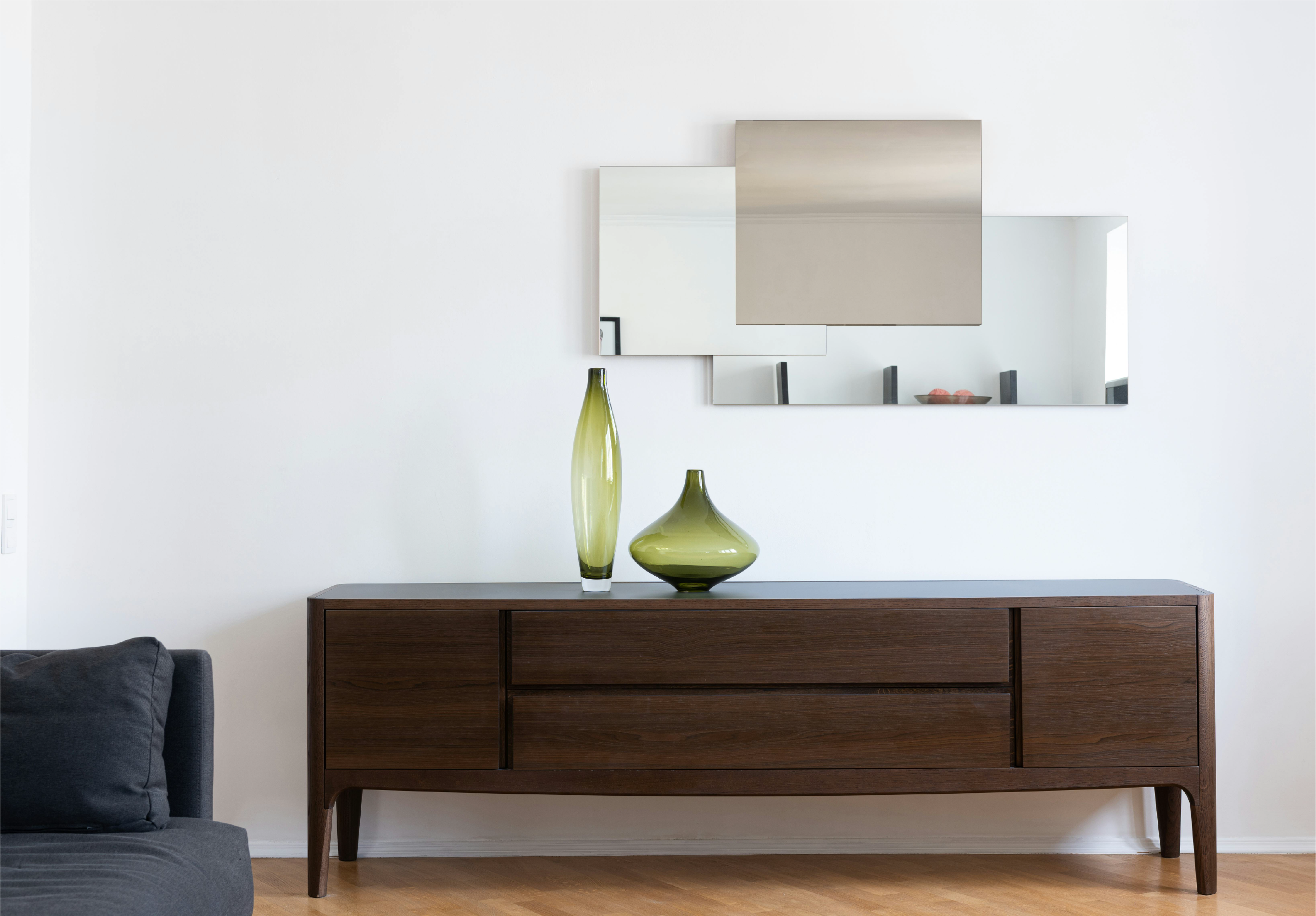 Wooden drawer with green glass vases