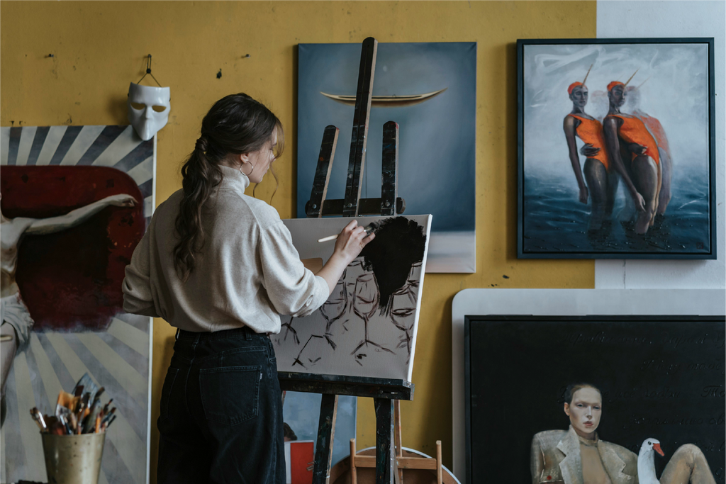 A girl painting on canvas